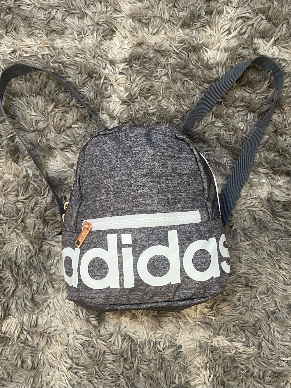Adidas Linear Jersey mini backpack in onix grey heathered fabric.
100% recycled
